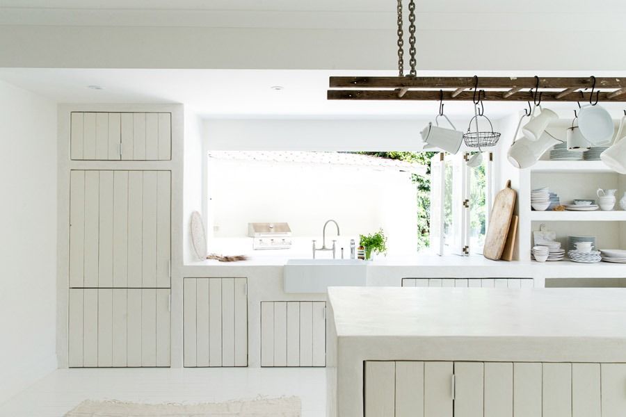 Bright White Modern Kitchen with Window and Hanging Light Fixture — Fineworx Joinery in Warnervale, NSW