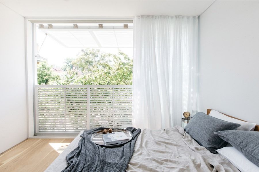 Bright Bedroom with Large Window and Balcony Greenery — Fineworx Joinery in Warnervale, NSW