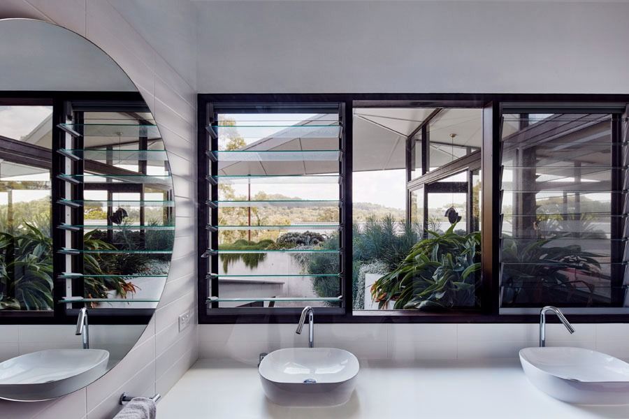 Modern Bathroom with Three Sinks and Black Framed Windows — Fineworx Joinery in Warnervale, NSW