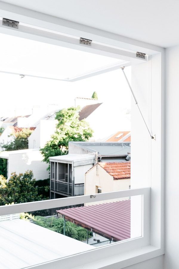 Open Window with White Frame Overlooking Rooftops and Green Plants — Fineworx Joinery in Warnervale, NSW