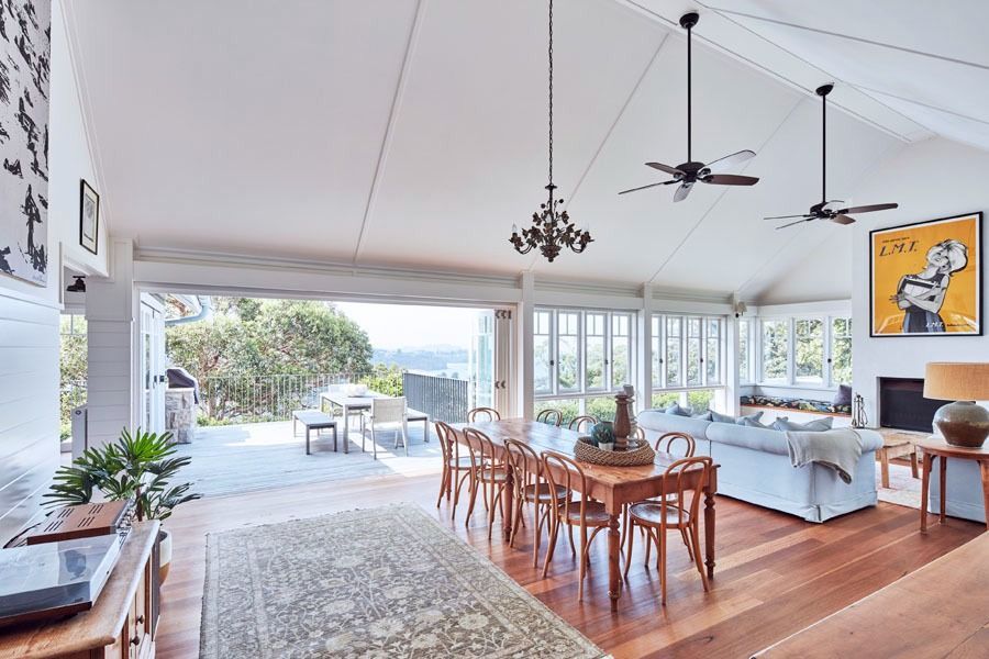 Open Plan Living and Dining Room with Wood Furnitures and Large Windows to A Patio — Fineworx Joinery in Warnervale, NSW