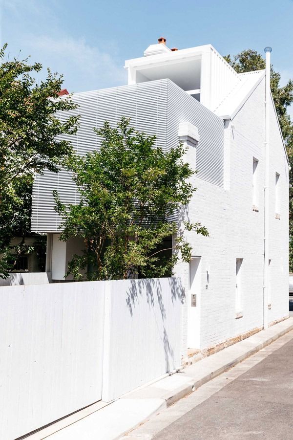White Modern House Behind a White Fence on A Quiet Street — Fineworx Joinery in Warnervale, NSW