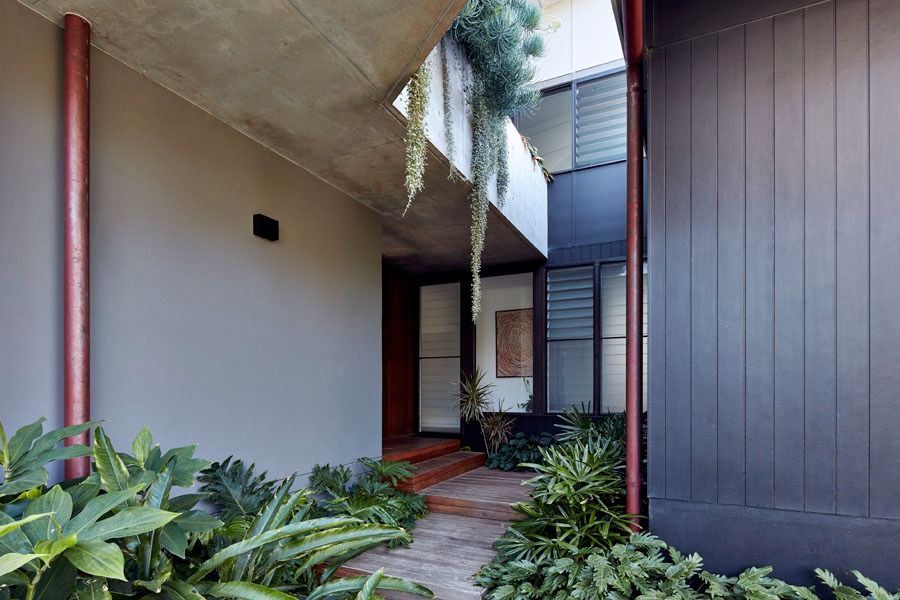 Modern Covered Walkway with Potted Greenery and Hanging Plants — Fineworx Joinery in Warnervale, NSW