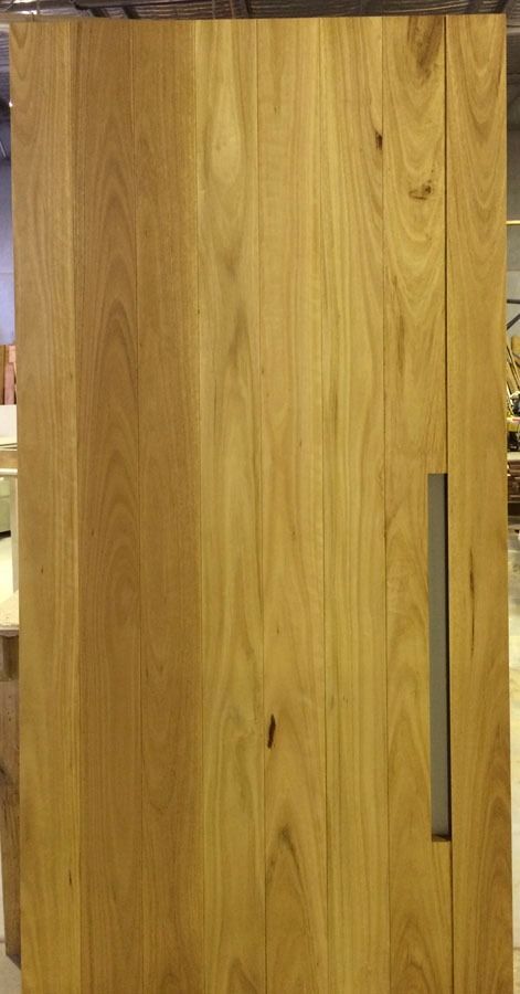 Wooden Cabinet Door with A Vertical Metal Handle — Fineworx Joinery in Warnervale, NSW
