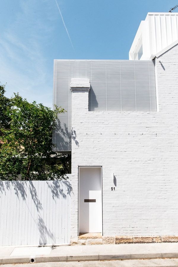 White Brick House Facade with A Small Front Door — Fineworx Joinery in Warnervale, NSW