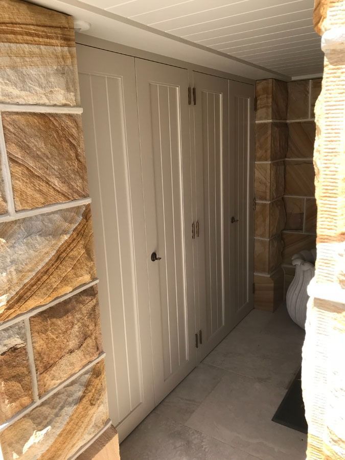 Narrow Outdoor Side Passage with Beige Storage Doors — Fineworx Joinery in Warnervale, NSW