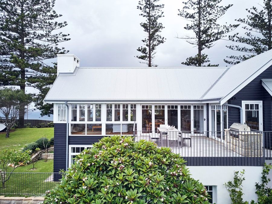 Modern House with White Roof and A Porch Among Tall Pine Trees — Fineworx Joinery in Warnervale, NSW