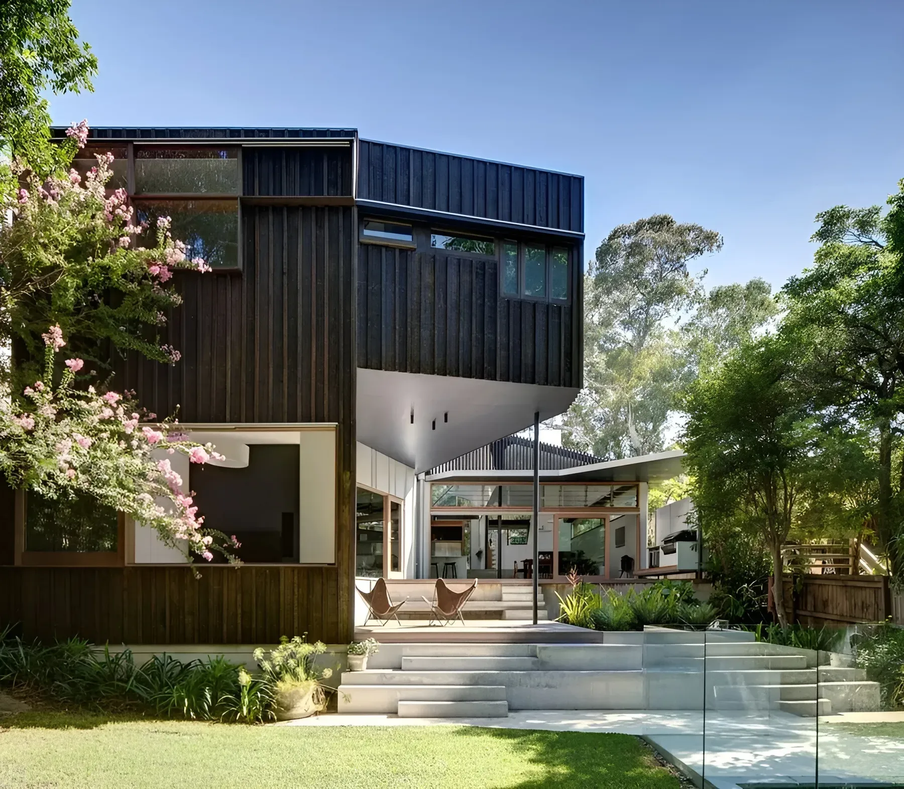 Modern Two Story House with Dark Wood Siding — Fineworx Joinery in Warnervale, NSW