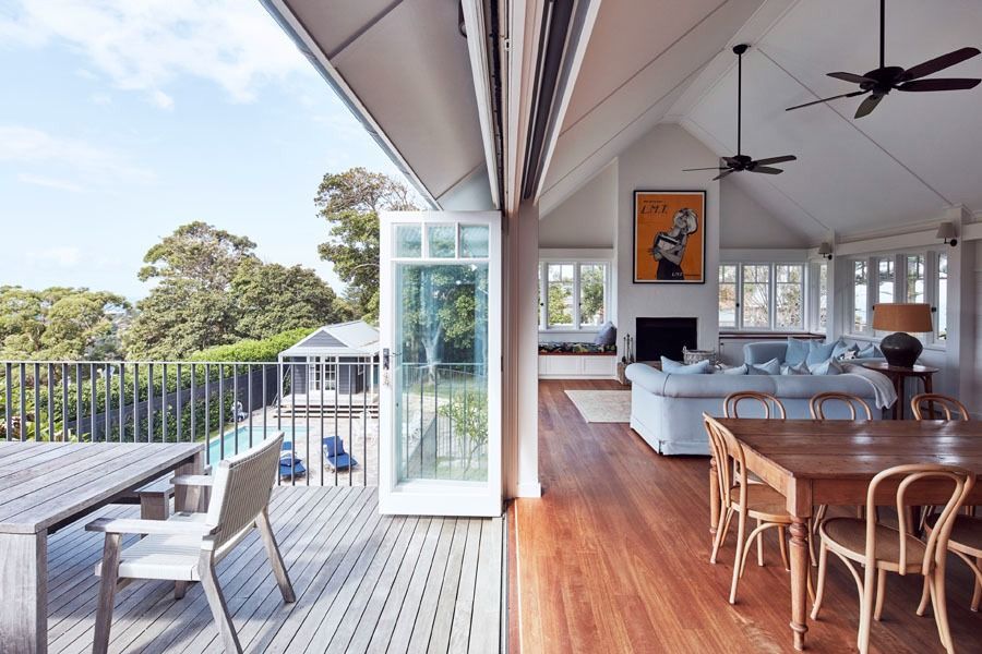 Spacious Covered Deck with Open Glass Doors to A Bright Outdoor View — Fineworx Joinery in Warnervale, NSW