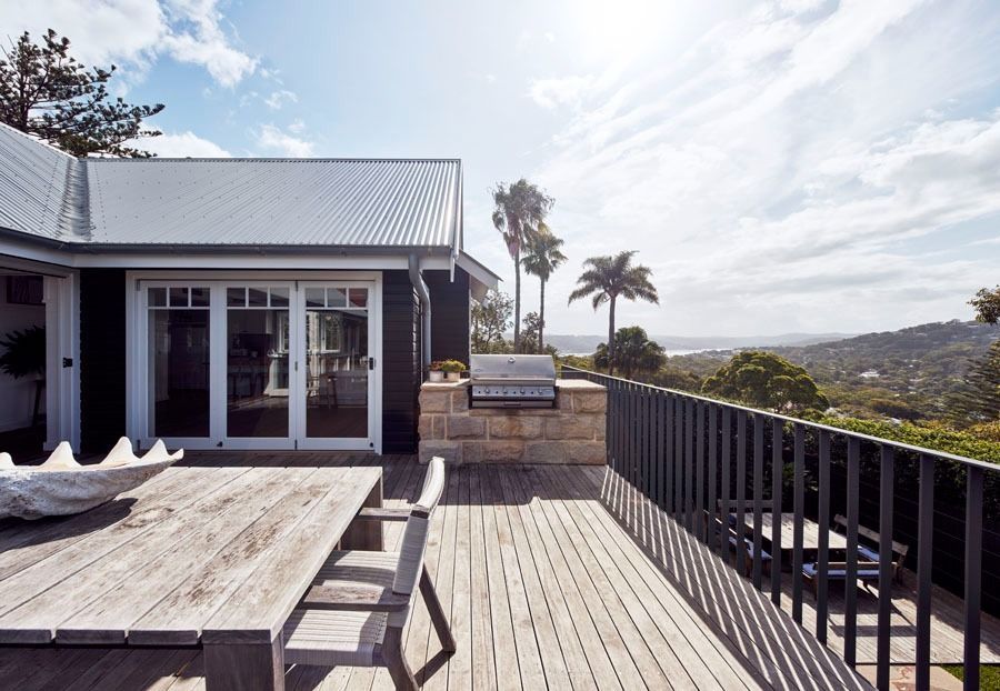 Sunlit Deck with Outdoor Dining Table and Hillside Ocean View — Fineworx Joinery in Warnervale, NSW