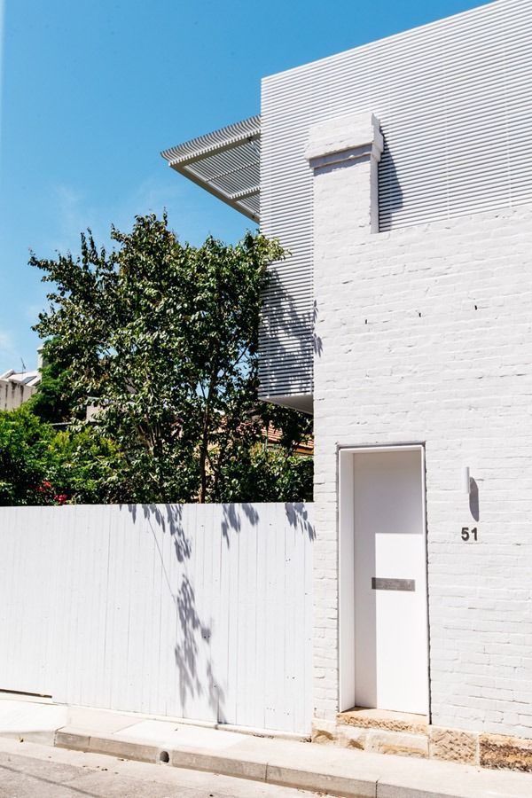White Brick House Facade with A Small Door — Fineworx Joinery in Warnervale, NSW