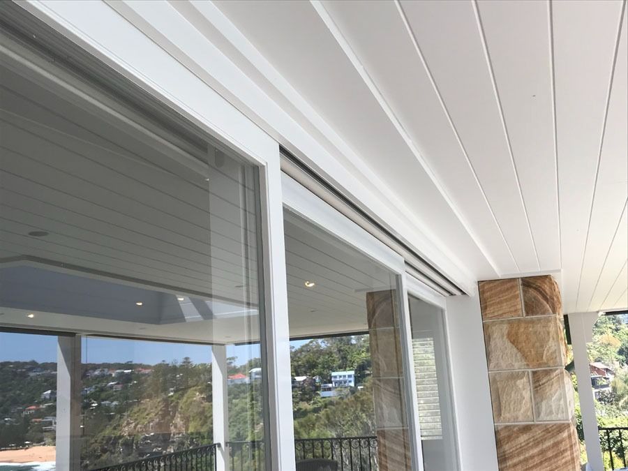 Covered Balcony with Glass Sliding Doors, and Stone Column — Fineworx Joinery in Warnervale, NSW