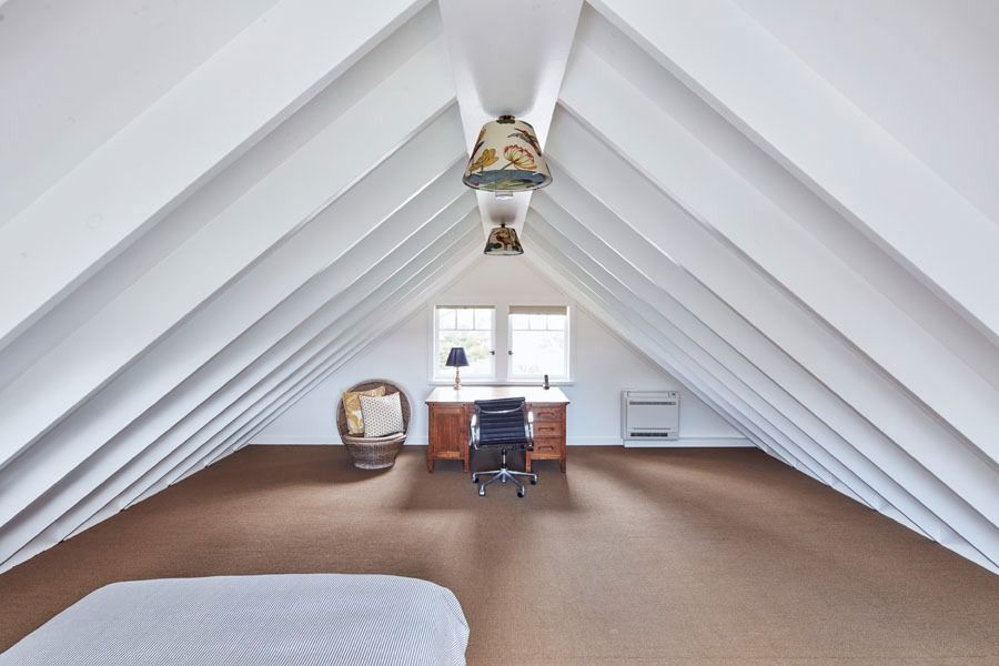 White Attic Bedroom with Sloped Ceiling — Fineworx Joinery in Warnervale, NSW