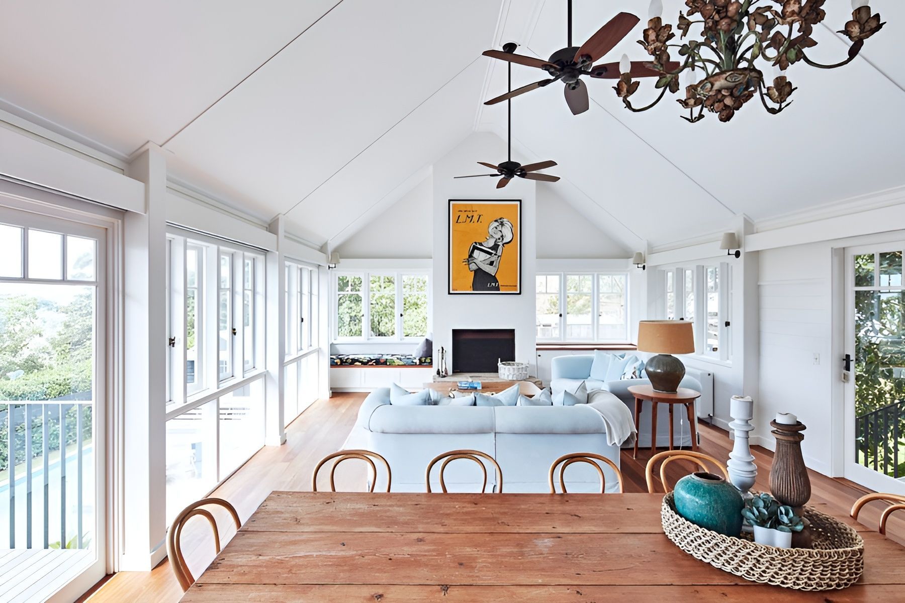 White Walled Sunroom with Rattan Chairs and Wooden Table — Fineworx Joinery in Warnervale, NSW