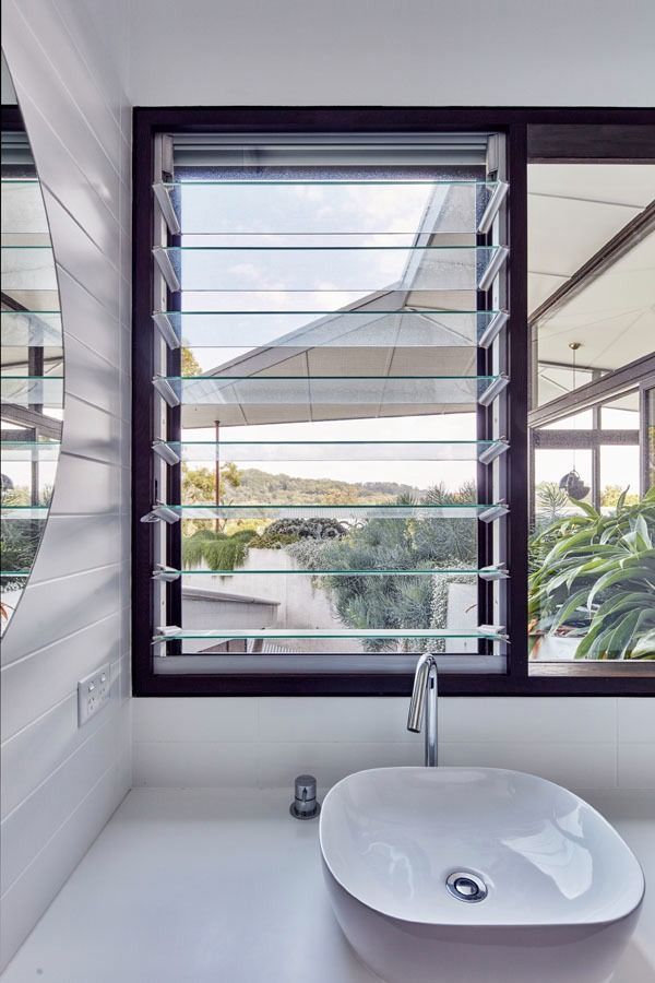 Bathroom Sink by A Window with Open Louvers — Fineworx Joinery in Warnervale, NSW