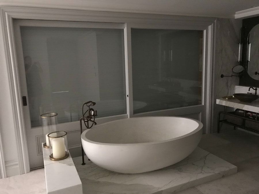 Modern Bathroom with A Large Oval Soaking Tub Beside a Glass Shower — Fineworx Joinery in Warnervale, NSW