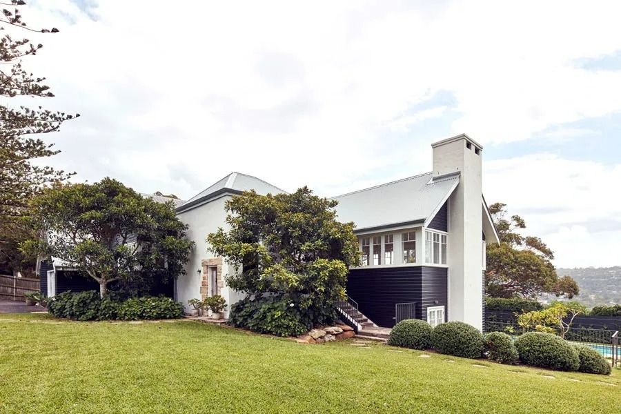 White House with A Gray Roof on A Grassy Hill — Fineworx Joinery in Warnervale, NSW