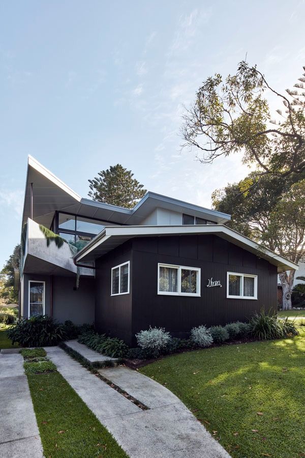 Modern Dark Gray House with A Curved Roof and Walkway Under Trees — Fineworx Joinery in Warnervale, NSW
