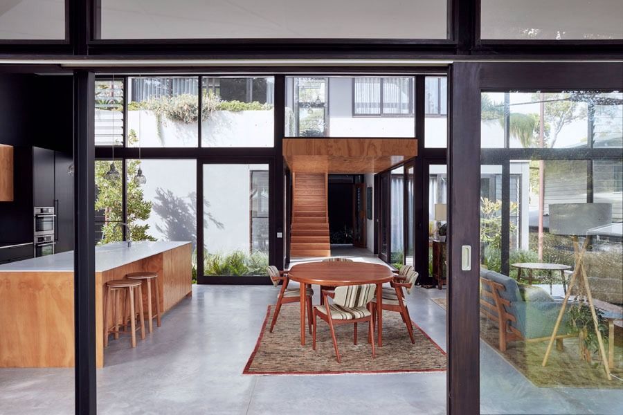 Modern Dining Room with Glass Walls and A Kitchen Island on The Left — Fineworx Joinery in Warnervale, NSW