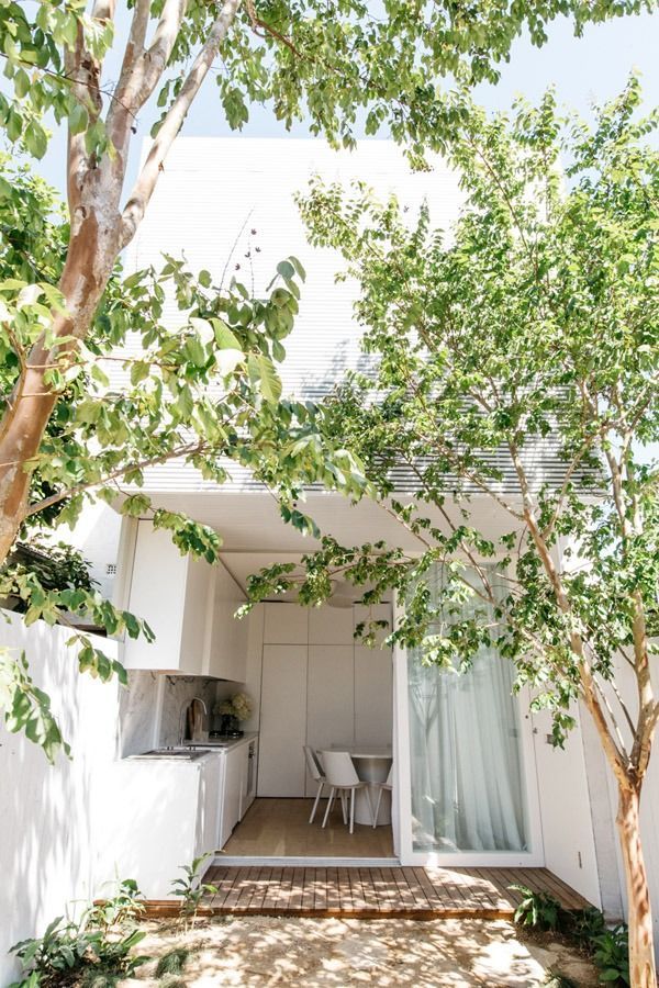 Modern White Patio with Two Chairs and Sliding Glass Door — Fineworx Joinery in Warnervale, NSW