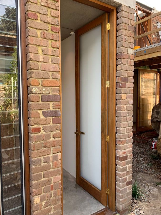 Open Wooden Doorway in A Brick Building — Fineworx Joinery in Warnervale, NSW
