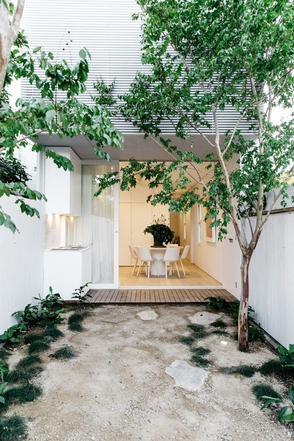 Modern White Courtyard with A Small Patio Leading to An Indoor Dining Area — Fineworx Joinery in Warnervale, NSW