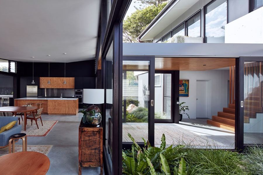 Modern Open Plan Living Area with Glass Walls — Fineworx Joinery in Warnervale, NSW