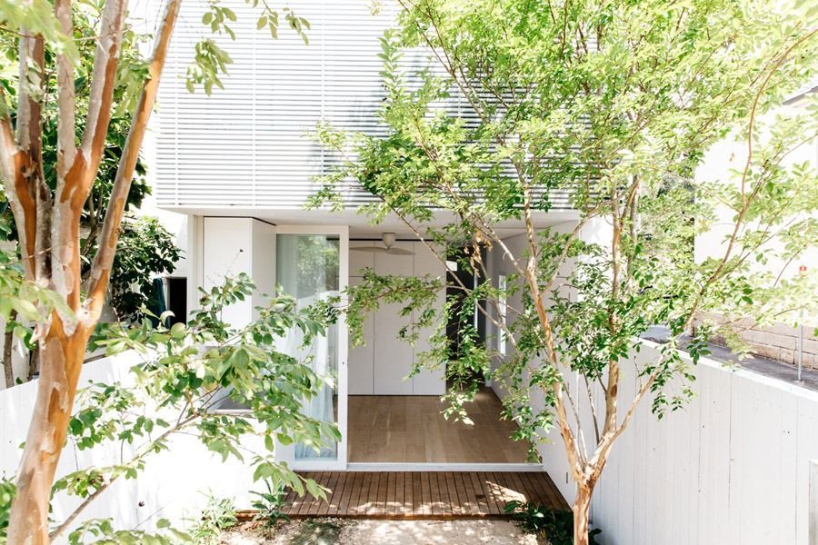 Modern House Entrance with White Siding and A Wooden Porch — Fineworx Joinery in Warnervale, NSW