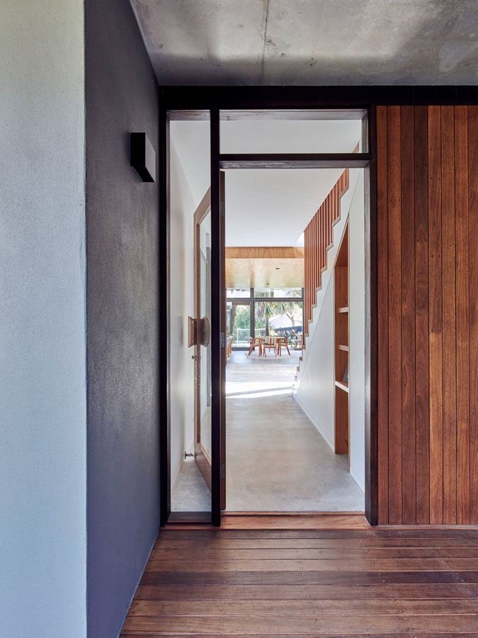 Modern Hallway with Wood Floors and An Open Door Leading to A Bright Patio Beyond — Fineworx Joinery in Warnervale, NSW