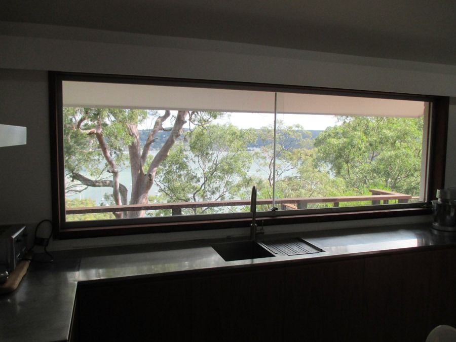 Kitchen Sink Beneath Large Window Overlooking Trees and Water — Fineworx Joinery in Warnervale, NSW