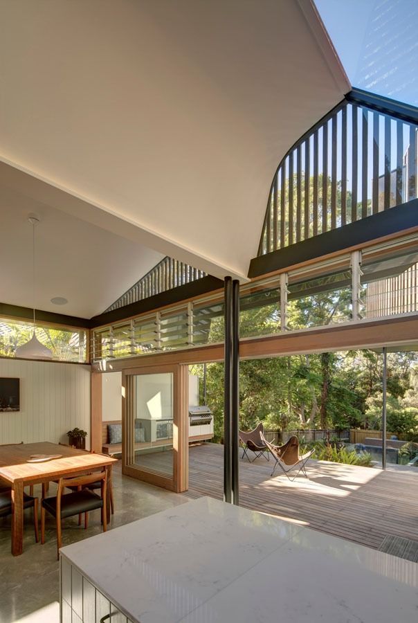 Open Indoor-Outdoor Dining Area with Large Glass Doors and Slatted Skylight Ceiling — Fineworx Joinery in Nambucca Heads, NSW