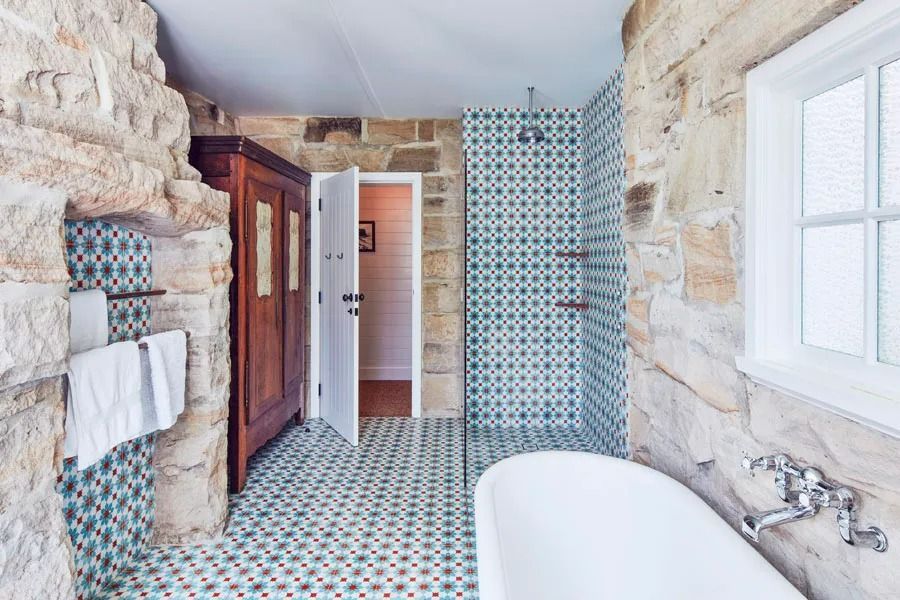 Stone Bathroom with Mosaic Tile Shower and Wooden Cabinet Under a Window — Fineworx Joinery in Warnervale, NSW