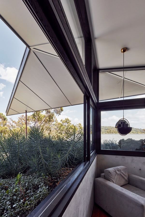 Modern Living Room with Open Window Views and Awnings Over Greenery — Fineworx Joinery in Warnervale, NSW