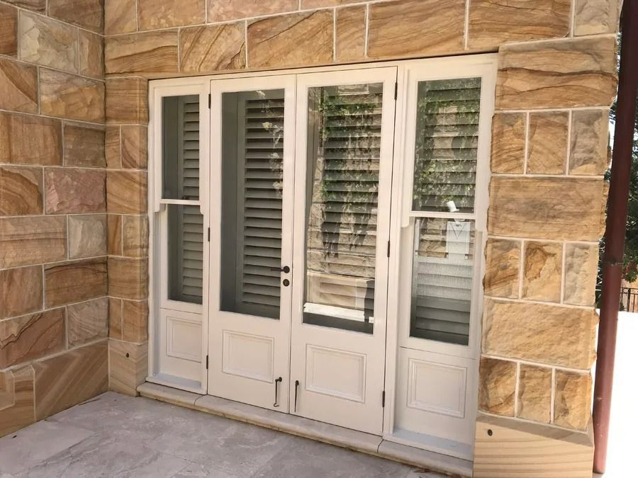 White French Doors Set in A Stone Exterior Wall — Fineworx Joinery in Warnervale, NSW