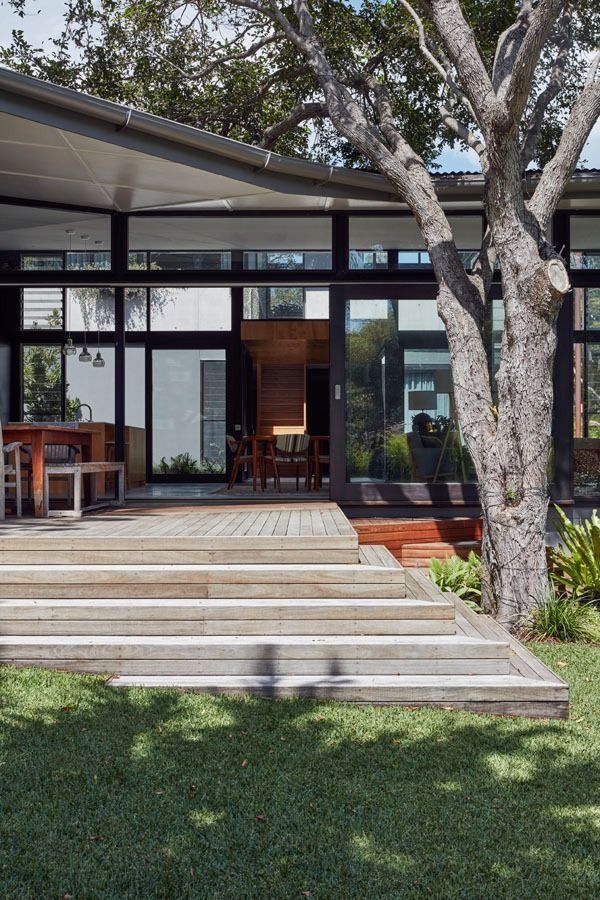 Modern House Entrance with  Glass Doors and A Large Tree in Front — Fineworx Joinery in Warnervale, NSW