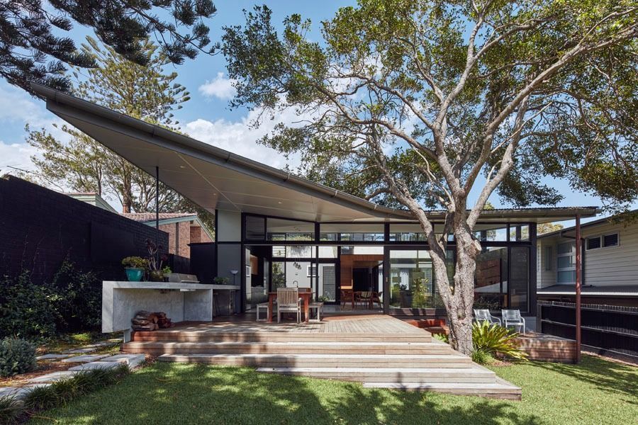 Modern House with Large Windows and A Front Deck Under Trees — Fineworx Joinery in Warnervale, NSW