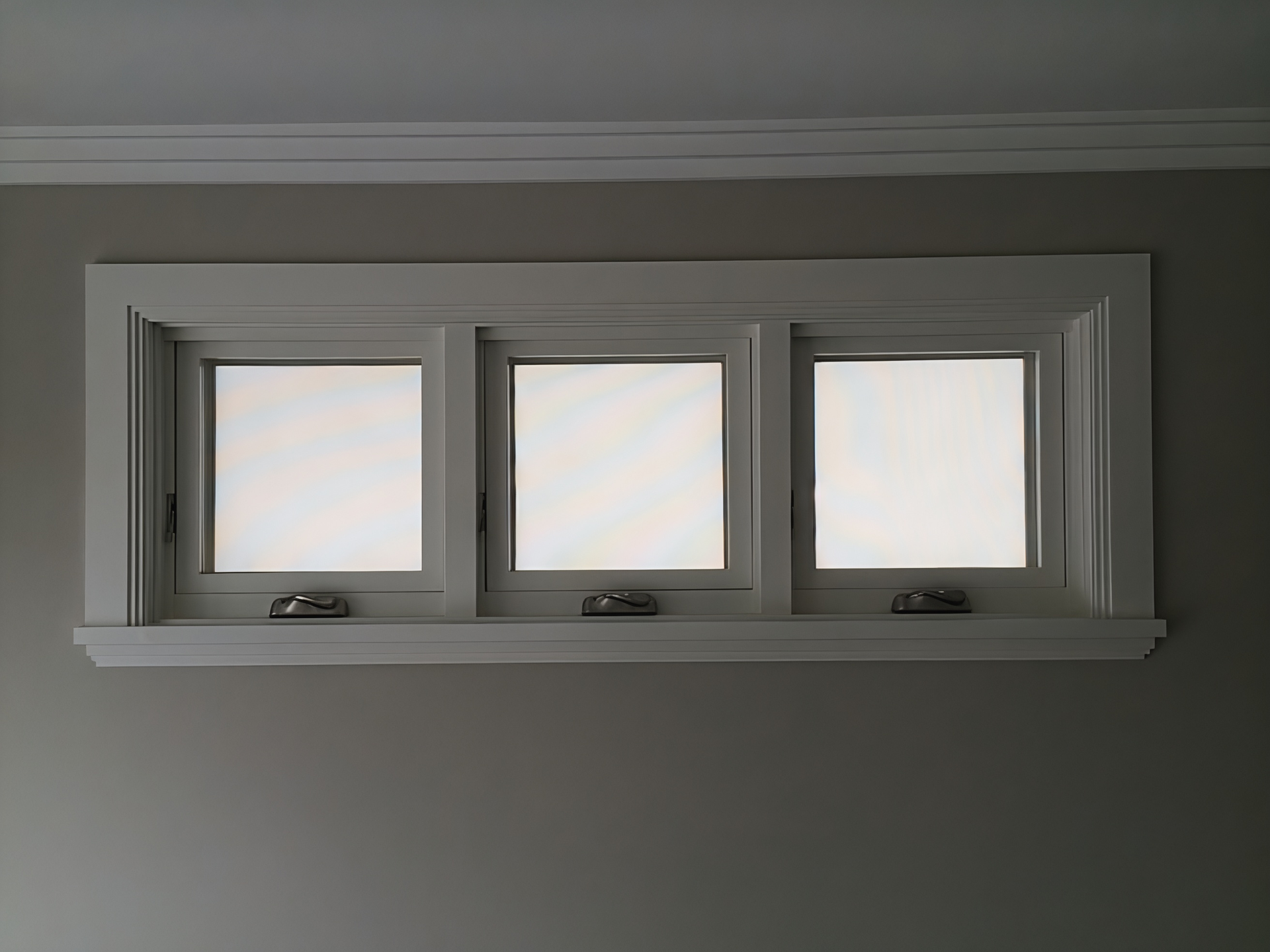 Three Small Frosted Windows in A Grey Wall with White Trim and A Narrow Ledge Below — Fineworx Joinery in Warnervale, NSW