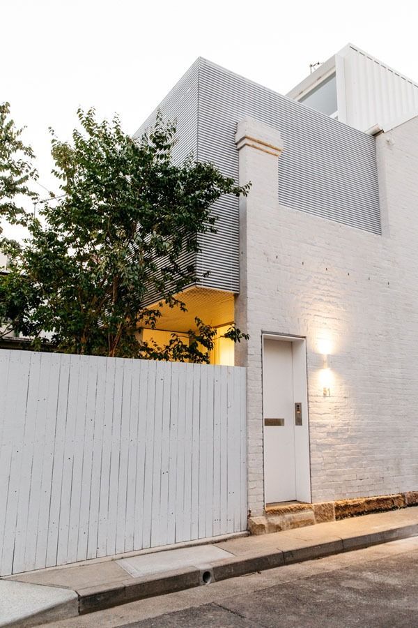Modern White House Facade with A Tall Fence — Fineworx Joinery in Warnervale, NSW