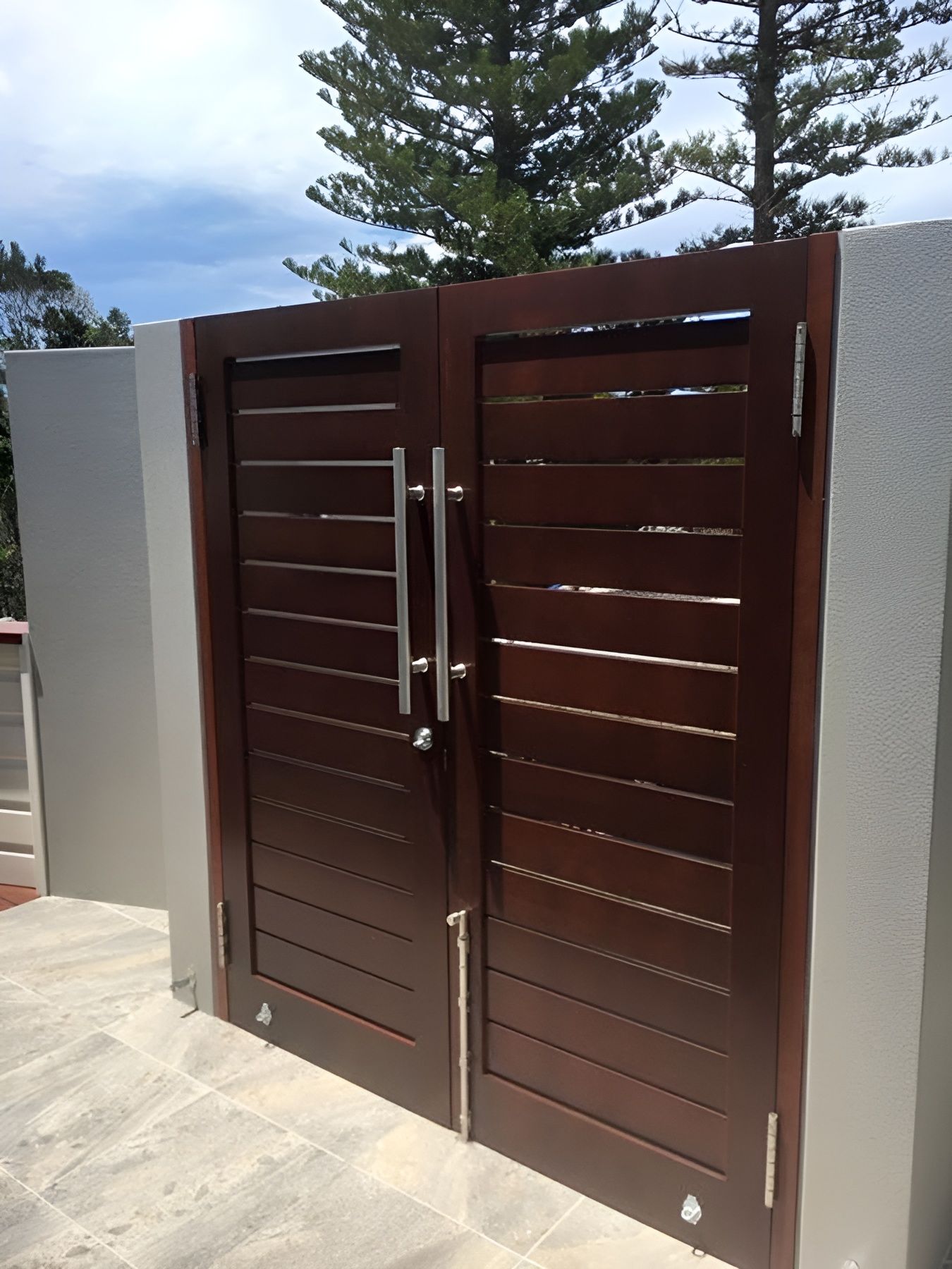 Brown Double Metal Gate with Horizontal Slats and Silver Handles — Fineworx Joinery in Warnervale, NSW