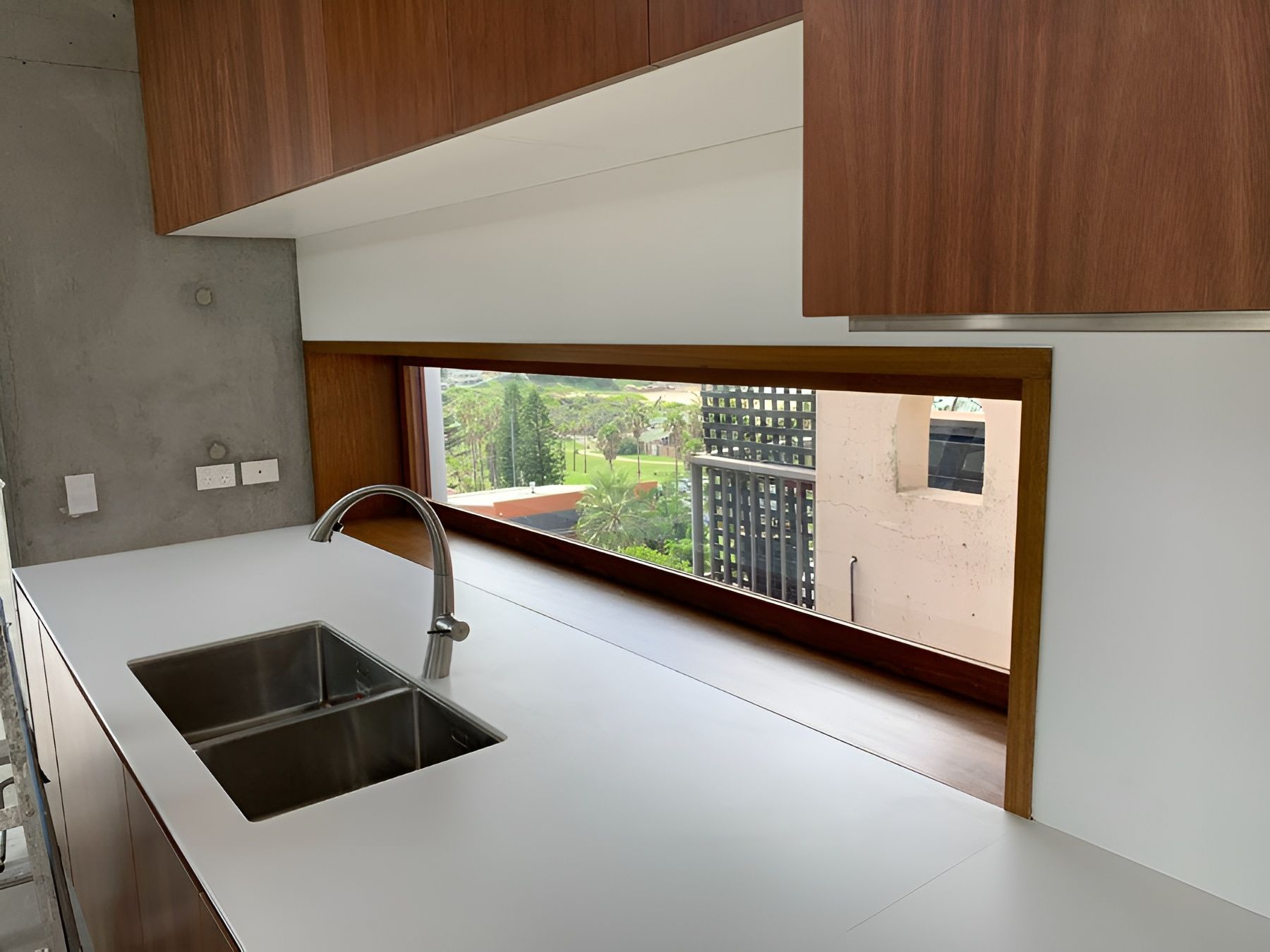 Modern Kitchen with A White Countertop and A Large Window — Fineworx Joinery in Warnervale, NSW
