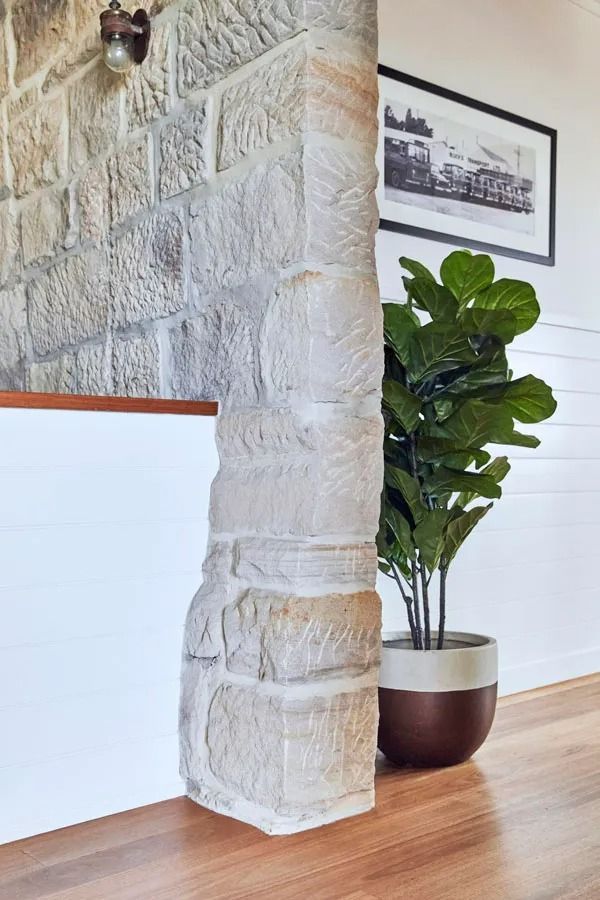 Stone Column in A Bright Room Beside a Potted Fiddle Leaf Fig and Framed Wall Art — Fineworx Joinery in Warnervale, NSW