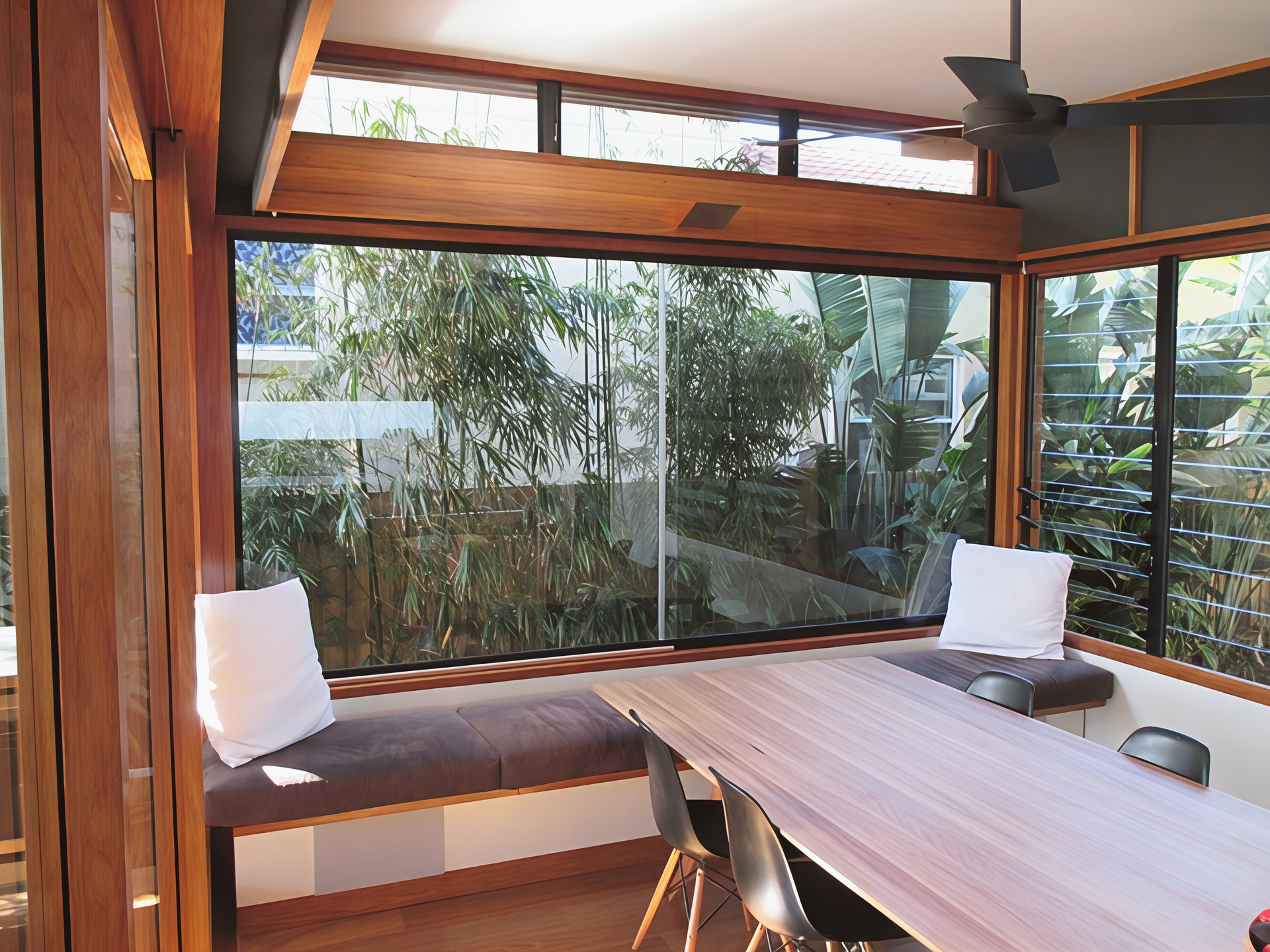 Wood Panelled Patio with A Long Table and Large Windows Overlooking Greenery — Fineworx Joinery in Warnervale, NSW