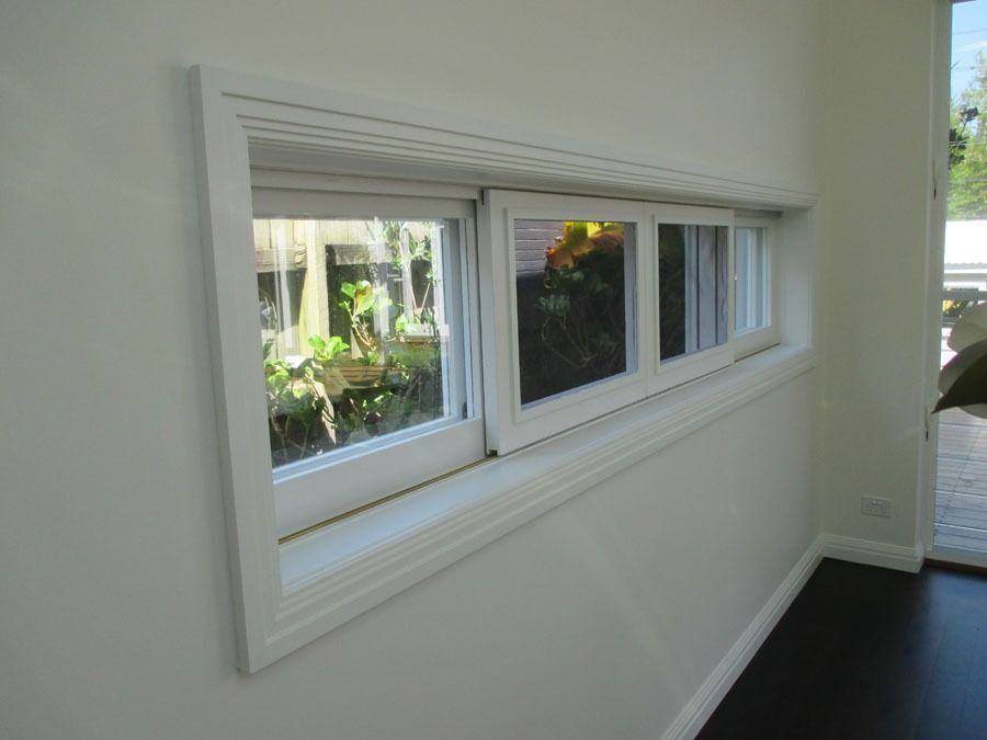 White Window with Three Sliding Panes in A Modern Interior Wall — Fineworx Joinery in Warnervale, NSW