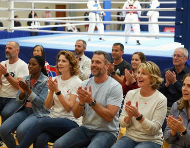 Parents and supporters cheering ringside