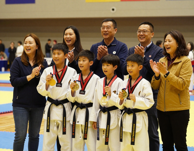 Families and athletes celebrating together at a tournament