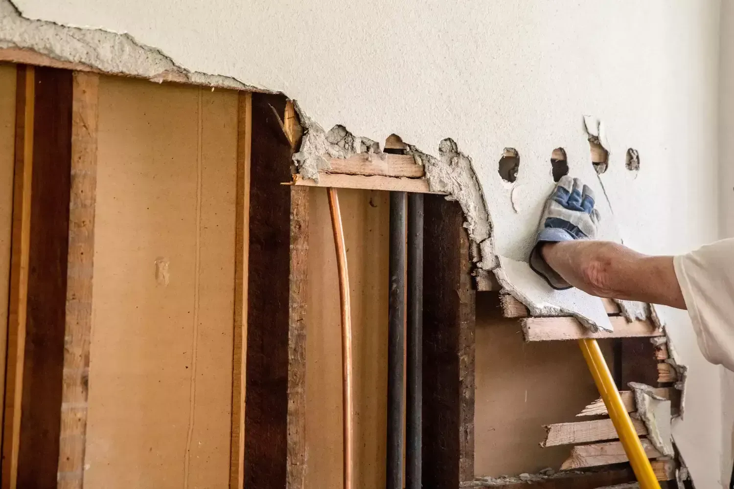 A wall with a hole in it.