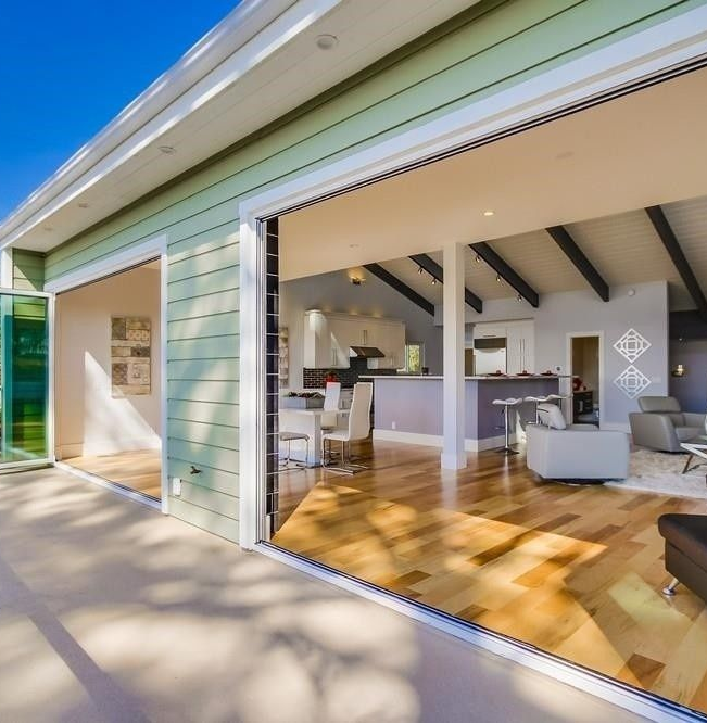 A living room with hardwood floors and sliding glass doors