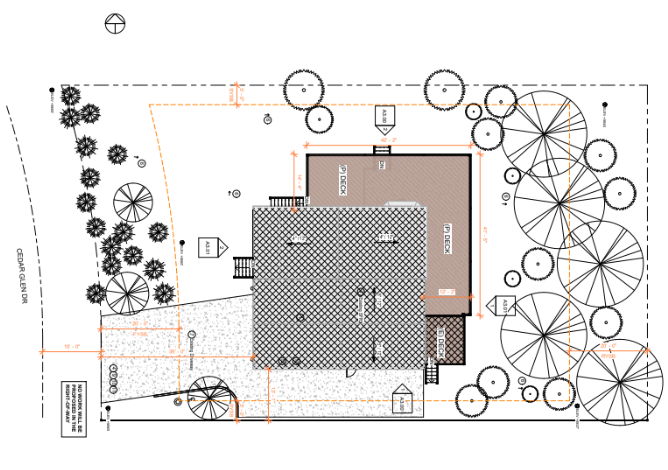 Site plan of a house with surrounding trees, paths, and property boundaries