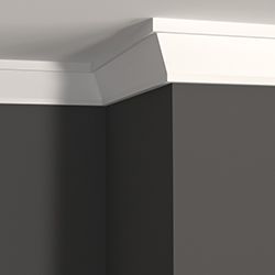 Close up of crown moulding and a dark grey wall