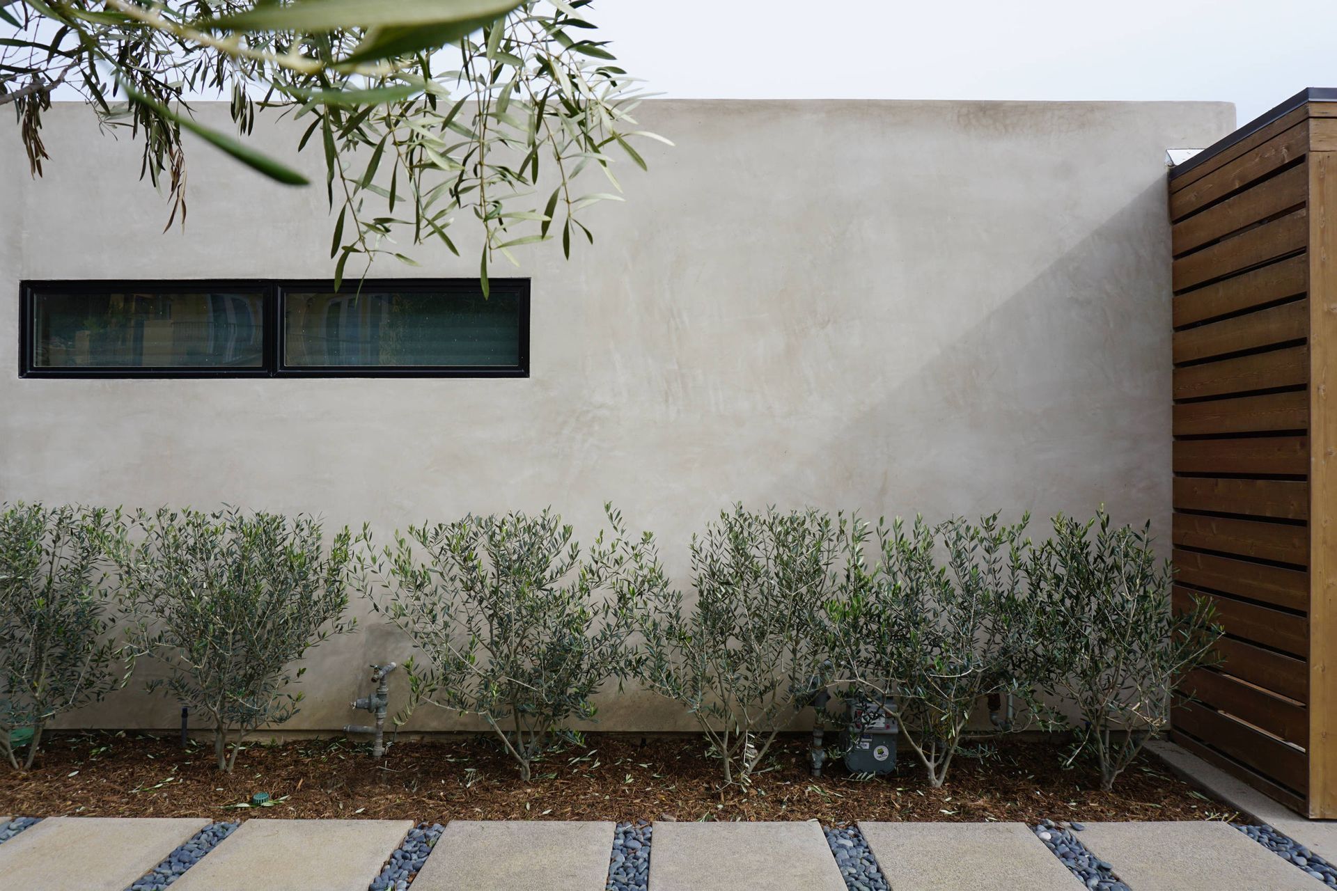 The exterior of a building covered in smooth stucco.